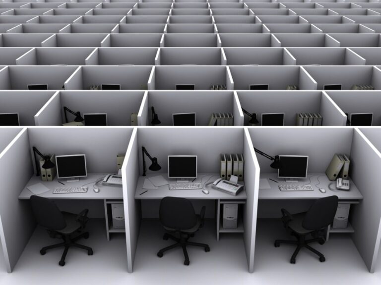 rows of empty grey cubicles